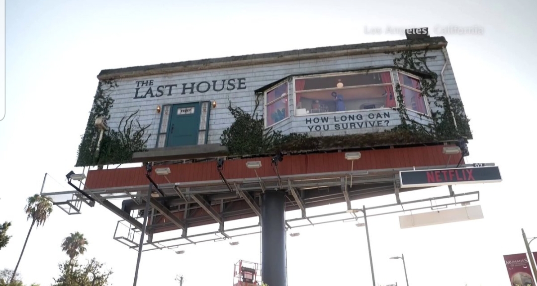 A man was spotted living inside a fully furnished room built into a billboard along Los Angeles’ Sunset Boulevard as part of a promotion for Netflix’s new sci-fi thriller “The Last House.”